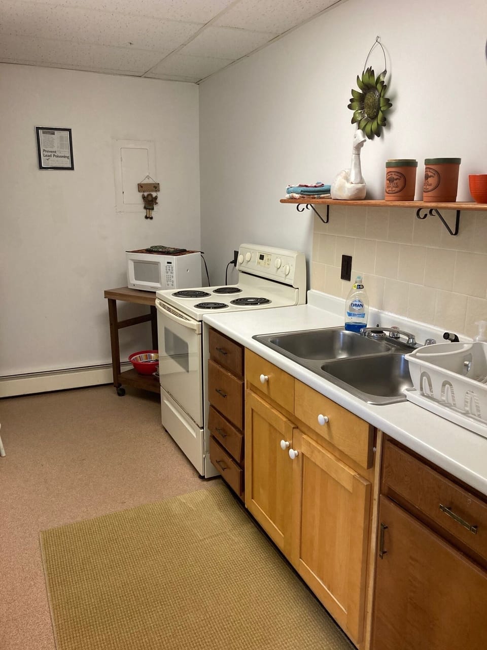Kitchen space with all refrigerator, microwave, stove/oven and all utensils.