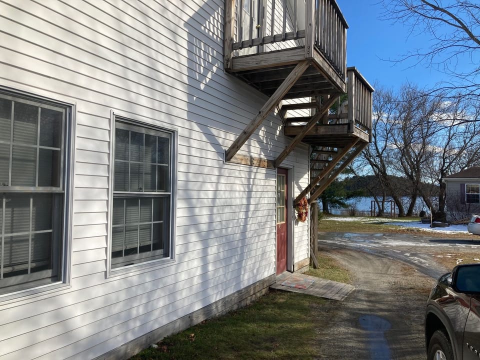 Front of building. Notice proximity to the lake in the background.