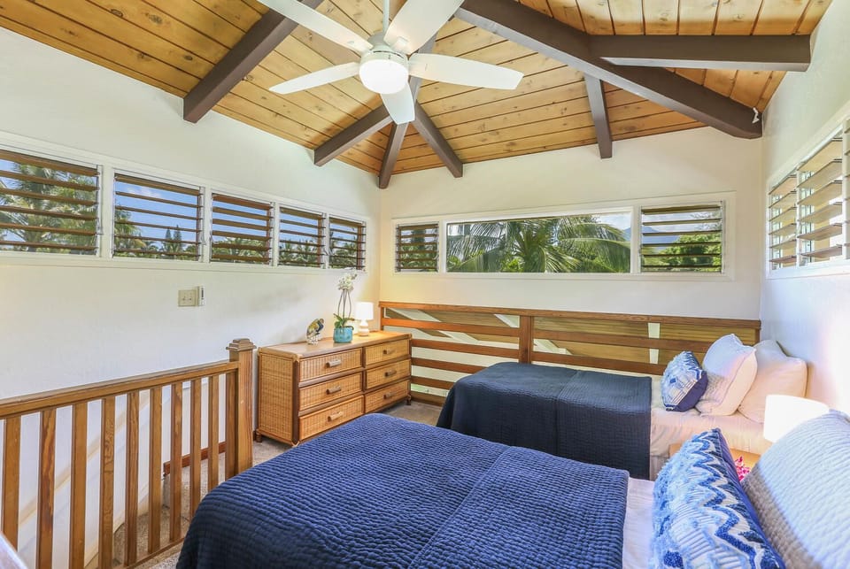 Perfect for kids or guests, this airy loft bedroom offers comfort and a playful escape.