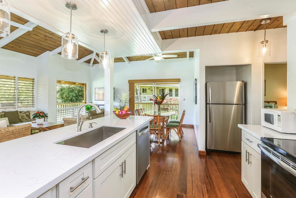 Kitchen equipped with modern appliance, perfect for preparing delicious meals.