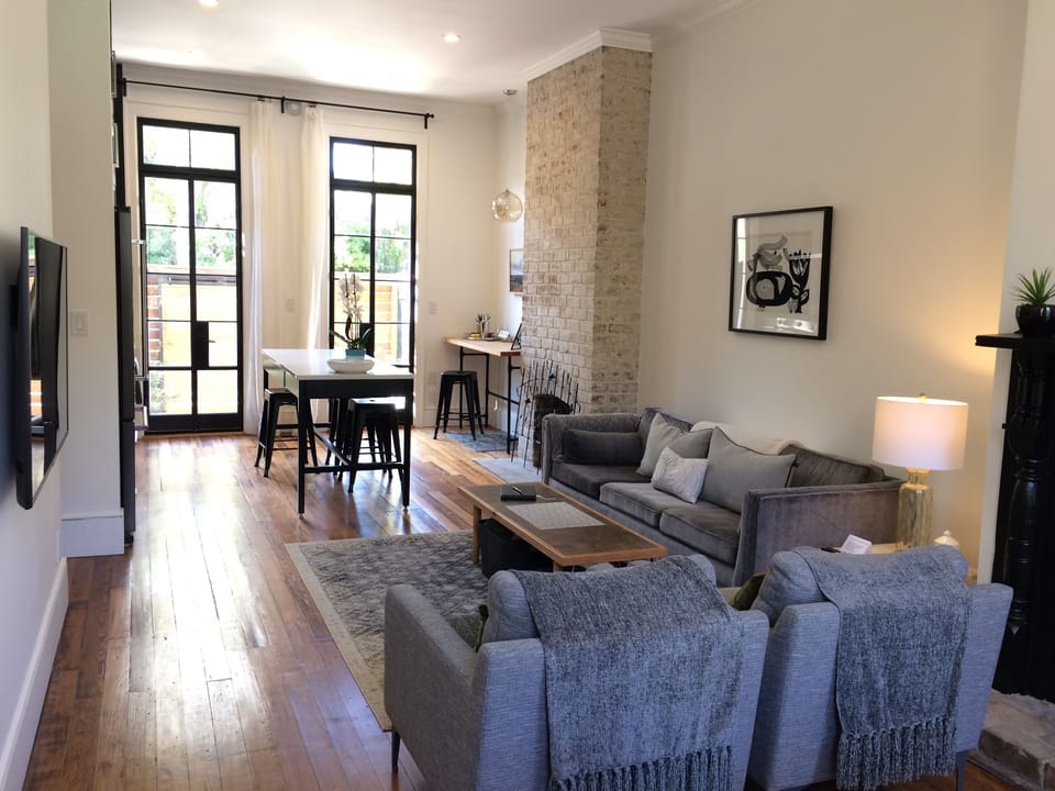 Open living room, dining & kitchen. High 11' ceilings; large windows throughout!