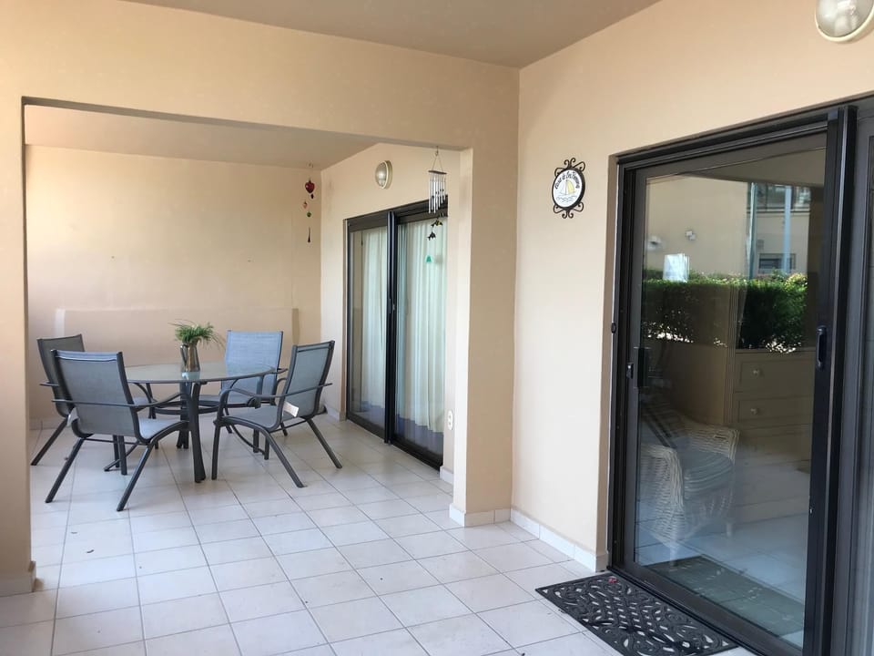 nice open patio with marina view and easy access to pool & lobby
