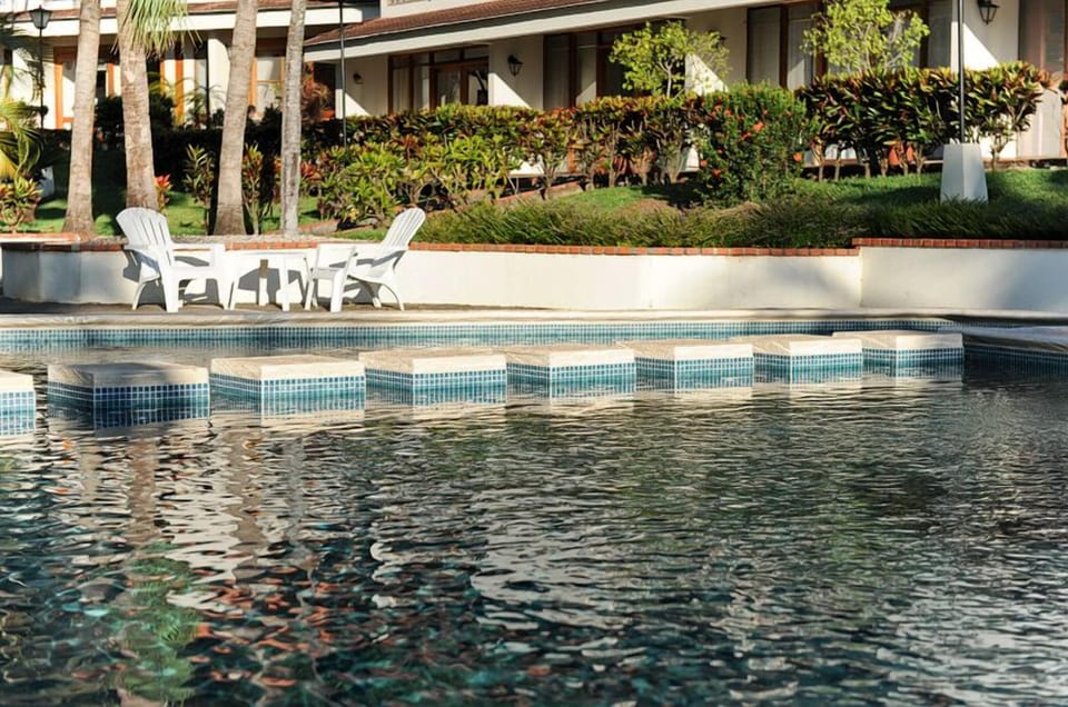 Large pool with stepping stones to relax on