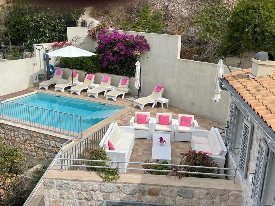 The top terrace (of 3) has lots of sunbeds and a large sofa area 