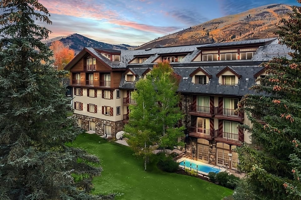 Stroll through manicured grounds to your mountain lodge retreat