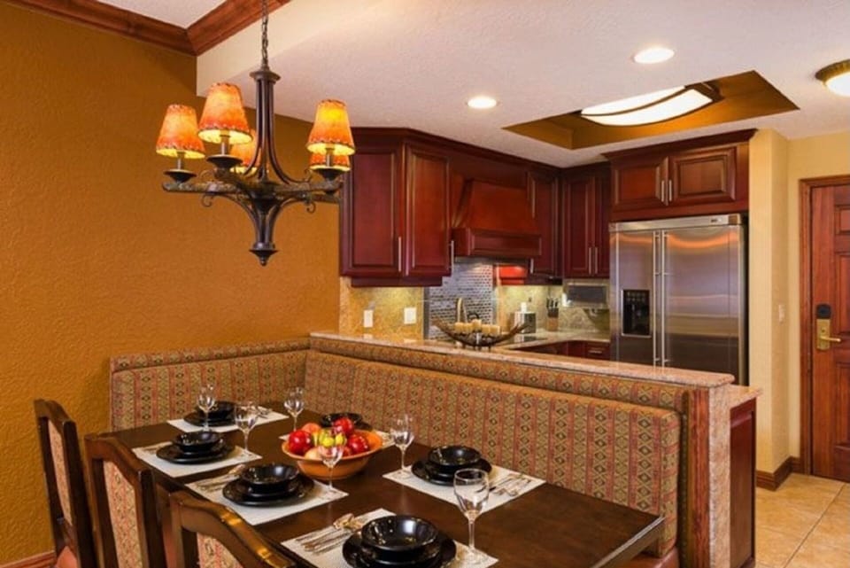 Dining room and full size kitchen with a dishwasher , coffee maker and microwave