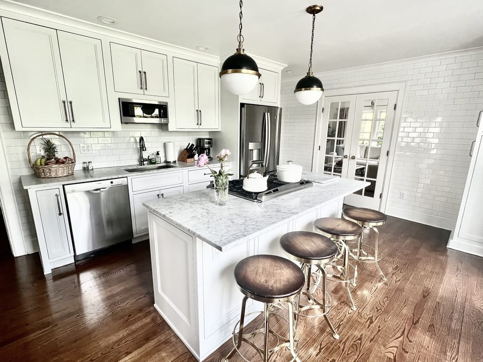 Chef’s kitchen w/gas stove, stainless appliances, high end cooking/serving ware.