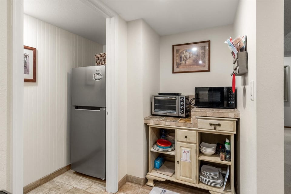 Larger fridge, convection oven and microwave.