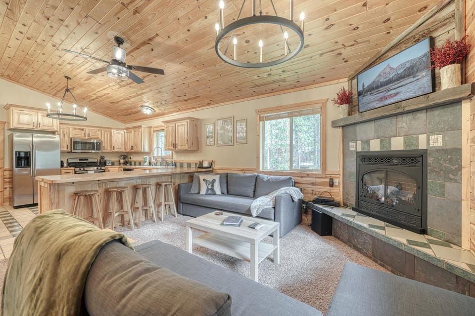 Open concept living room, kitchen, and dining. 