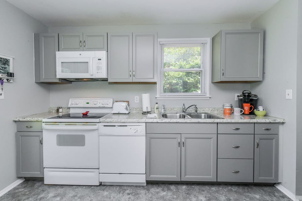 Fully furnished kitchen with cookware essentials.