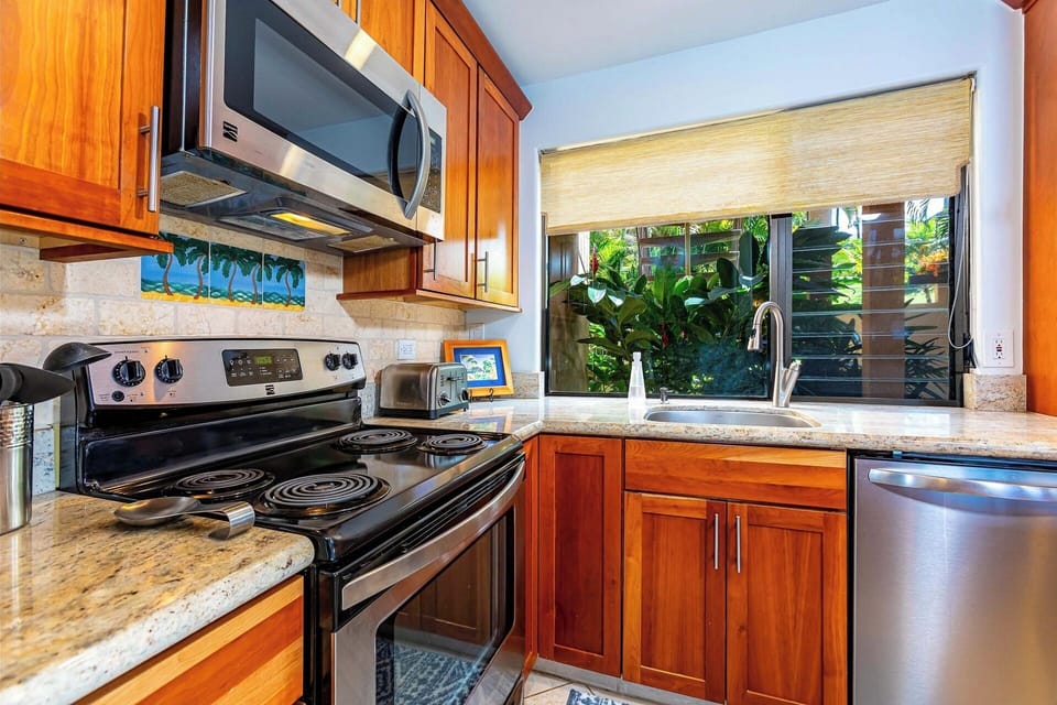 Stainless steel microwave, stove, oven and dishwasher.