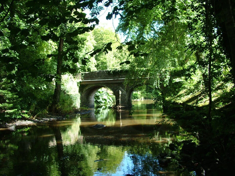 River & historic bridge beside the cottage