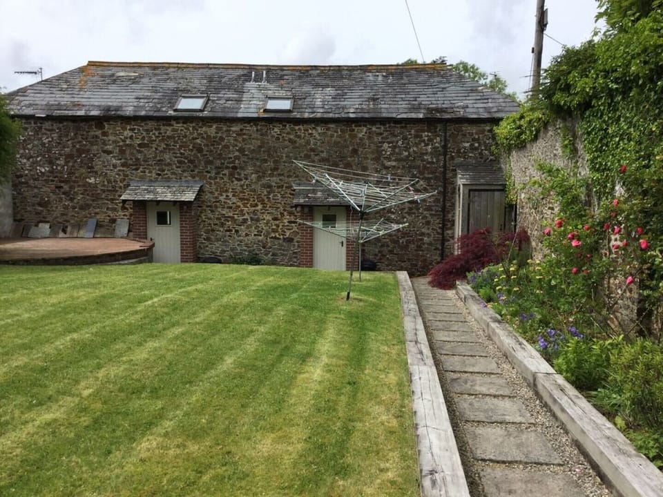Walled garden with doors to Stable on left and Coch to right
