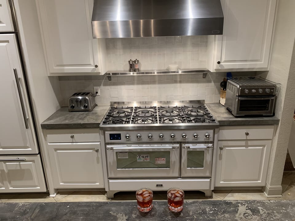 Chef's kitchen is efficient. New commercial range for the foodies in the group. 