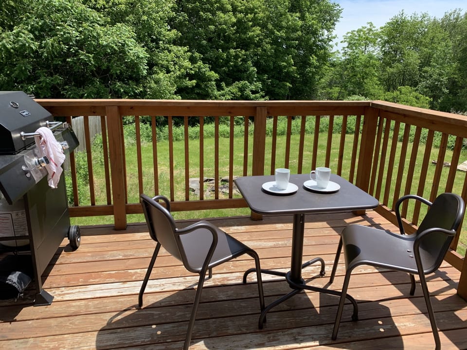 Outdoor Deck with BBQ grill and seating.