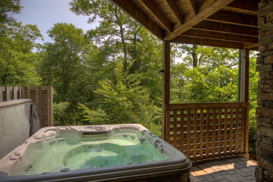 6 adults comfortably will fit in hot tub. Accessed downstairs.