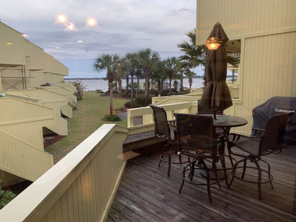 Back deck over looking the beach, pool, fishing dock and boat slips