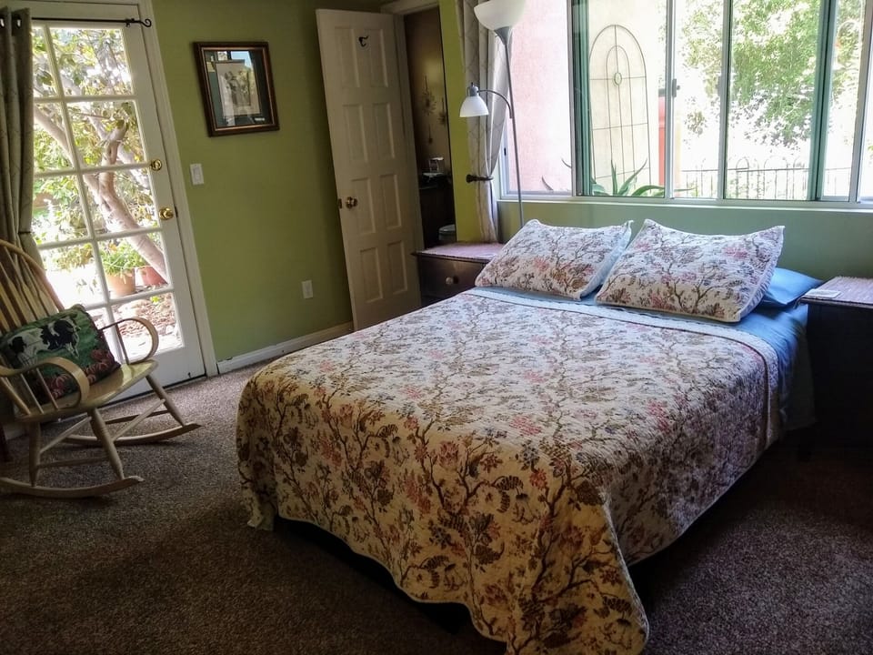 Spacious bedroom with en-suite bathroom,. side door to native plant garden.
