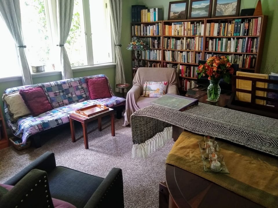 Cozy living room, plenty of natural light.