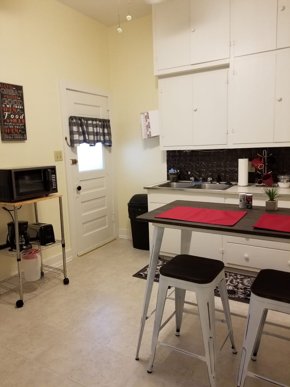 Seating for 2, microwave, toaster, 10 cu foot fridge. Small electric stove. 