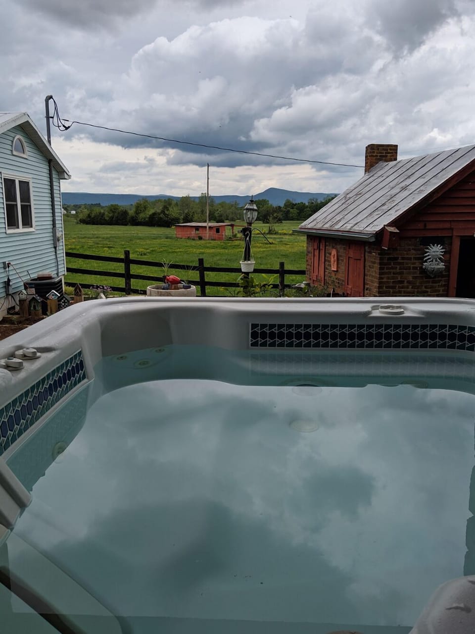 Hot tub with a view of the pasture.