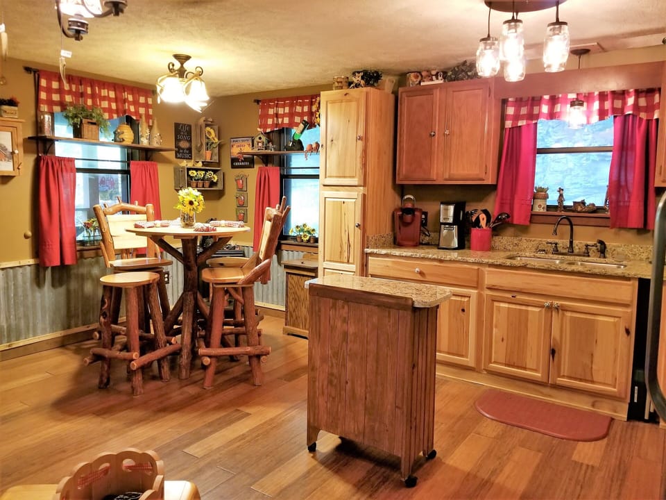 Everyone can visit in this open floor-plan kitchen, dining & living room 