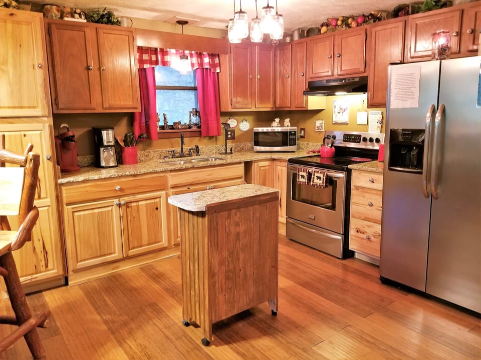 The kitchen has plenty of cabinets & countertop space-dishes-cookware-icemaker