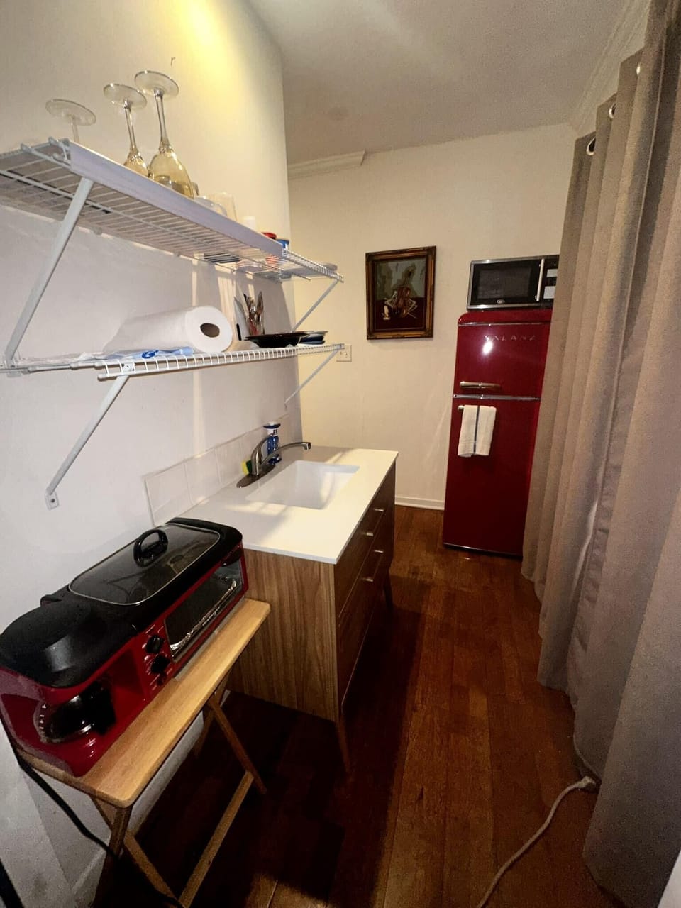 Kitchenette: refrigerator, microwave, coffee maker, utensils for two, small sink & cooktop. 