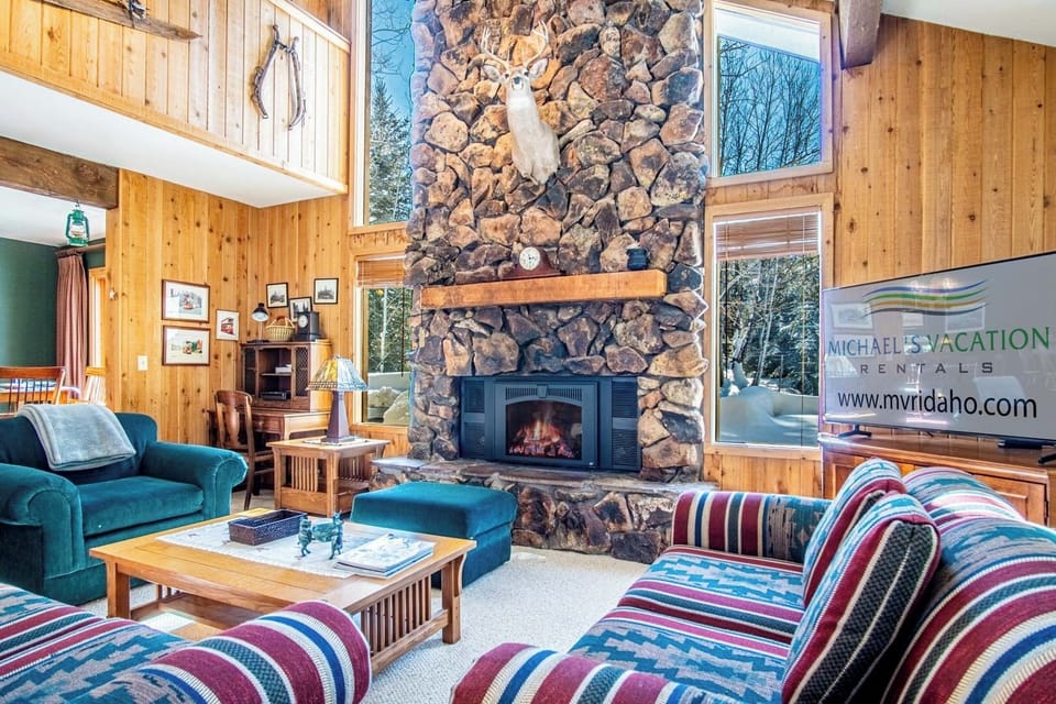 Relax by the fireplace in this sun-filled living room!