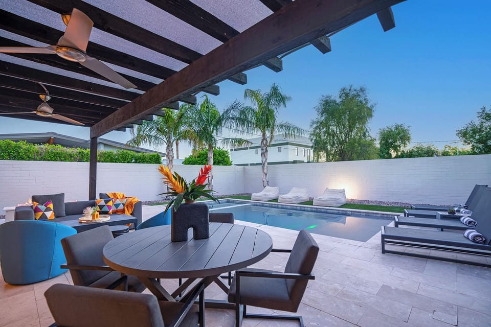 Outdoor dining, fire pit, propane grill, and loads of lounge chairs.