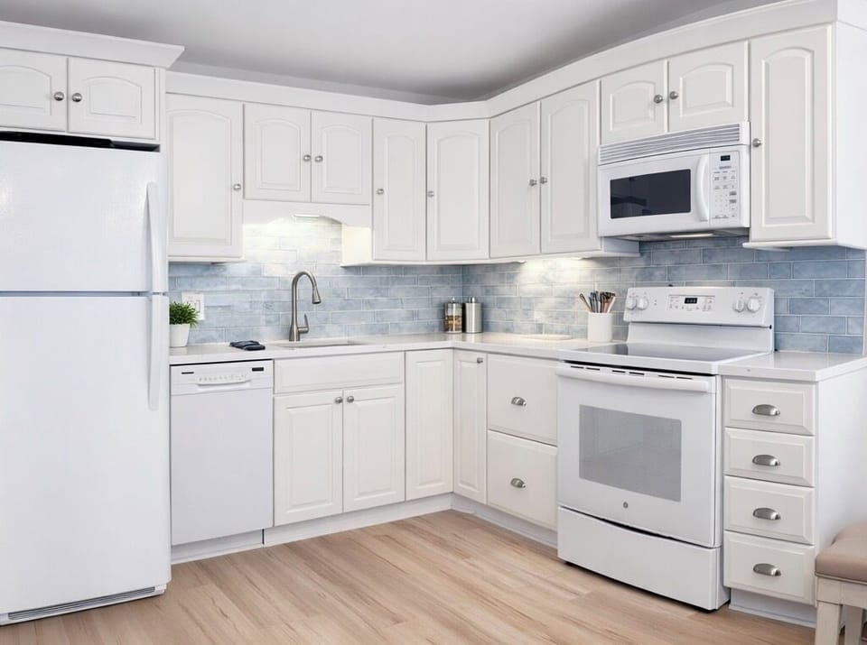 Fully stocked kitchen with new appliances and everything needed to enjoy a meal 