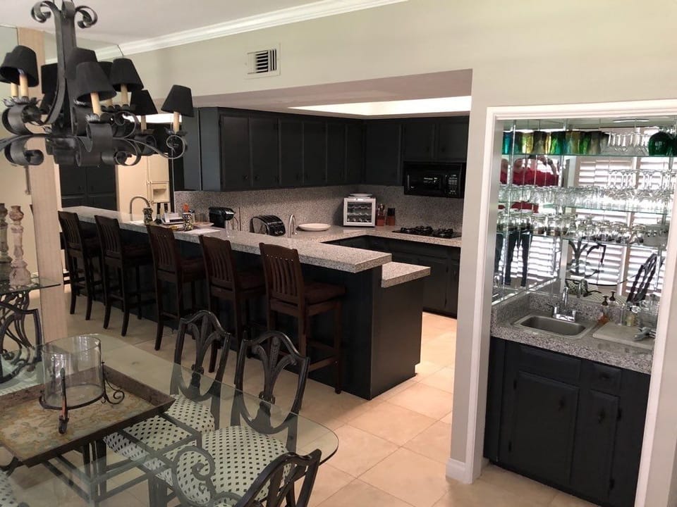 counter seating in kitchen adjacent to dining room