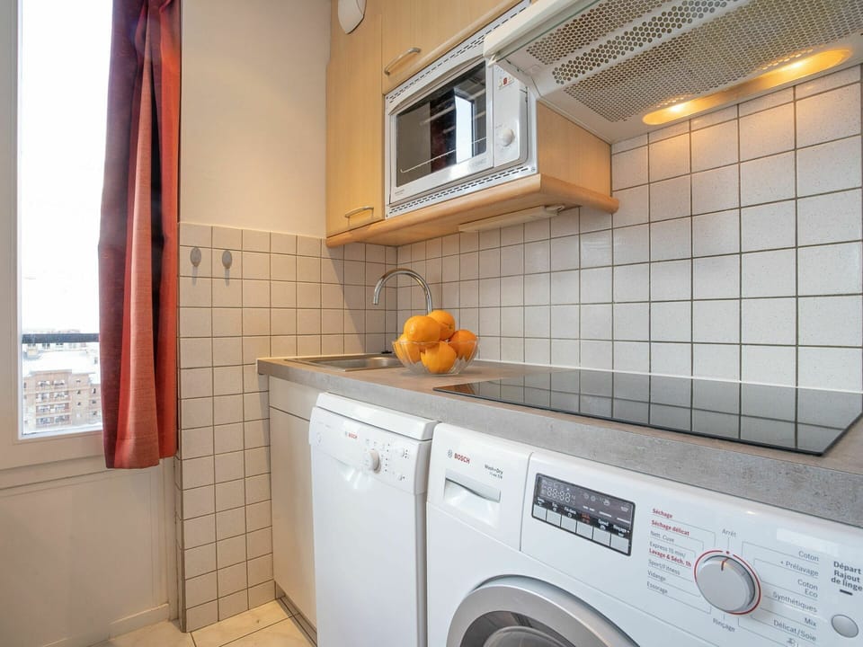 Laundry Room, Property, Window, Cabinetry, Washing Machine, Clothes Dryer, Building, Interior Design, Orange, Lighting
