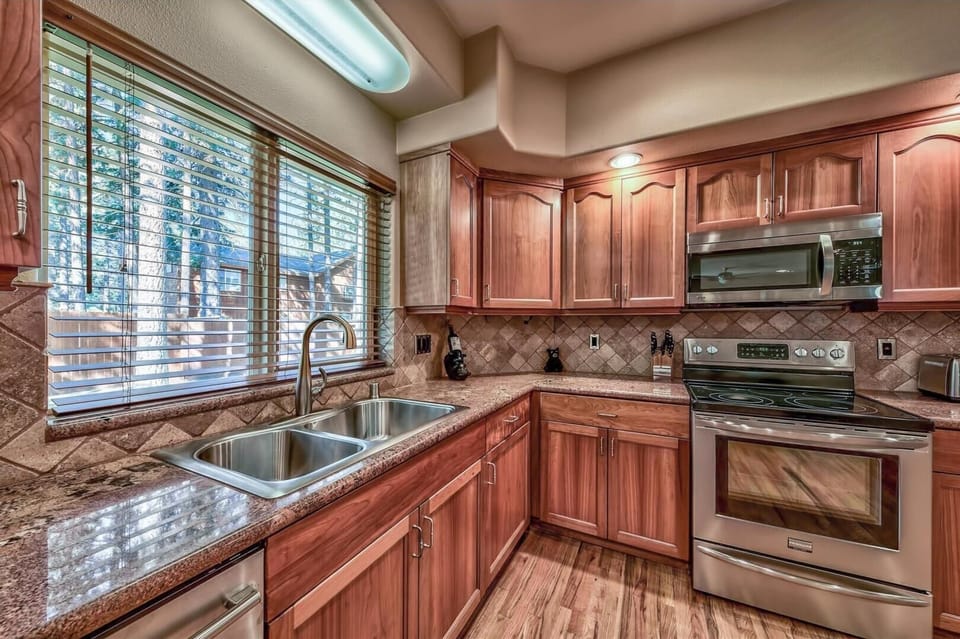 Stainless steel appliances, dishwasher, microwave, double sink, french door fridge/freezer - this kitchen has it all