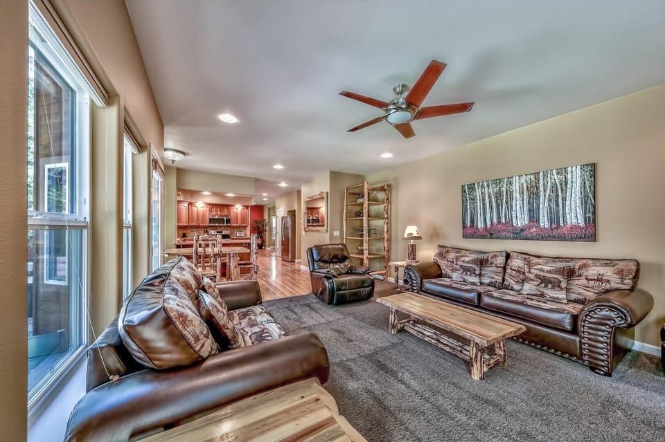 This second living room is open to the breakfast nook and kitchen