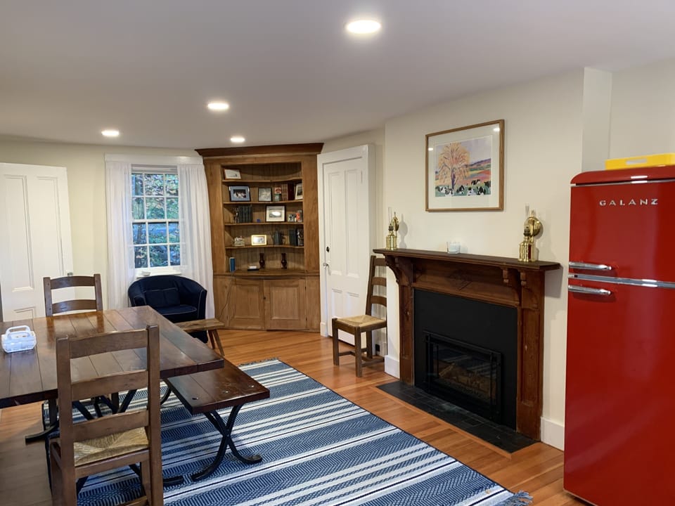Main room with fireplace and eating area