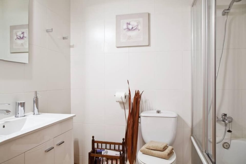 Bathroom with shower/bath tube. First aid kit, hair dryer...all the details