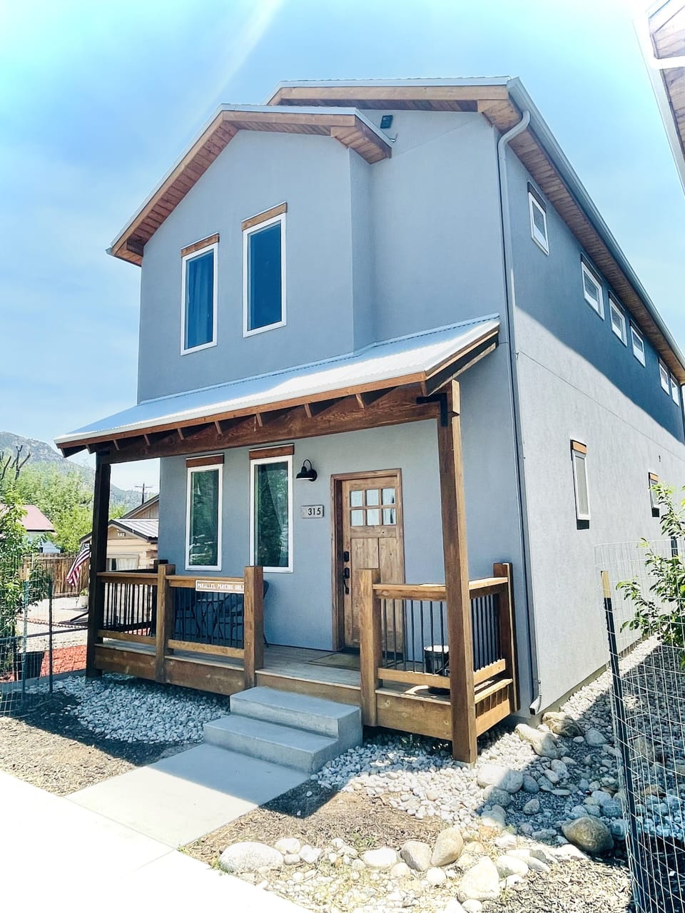 Single Family Home with front porch Seating.