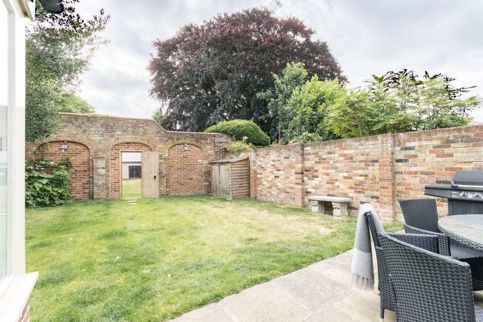 Garden gate leading into our sister property!  Rent  both for family gatherings!
