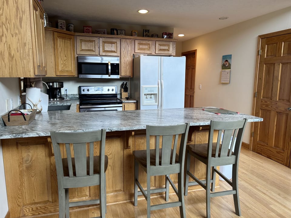 Kitchen with Granite Counters and Eating Area.