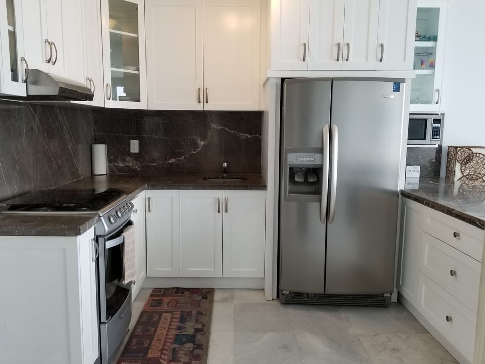 Large bright kitchen with plenty of storage and everything you need.