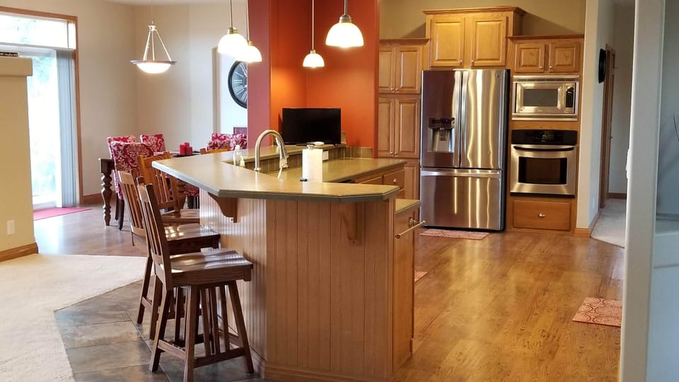 Well-stocked, modern kitchen, including 2 ovens and stainless steel appliances.