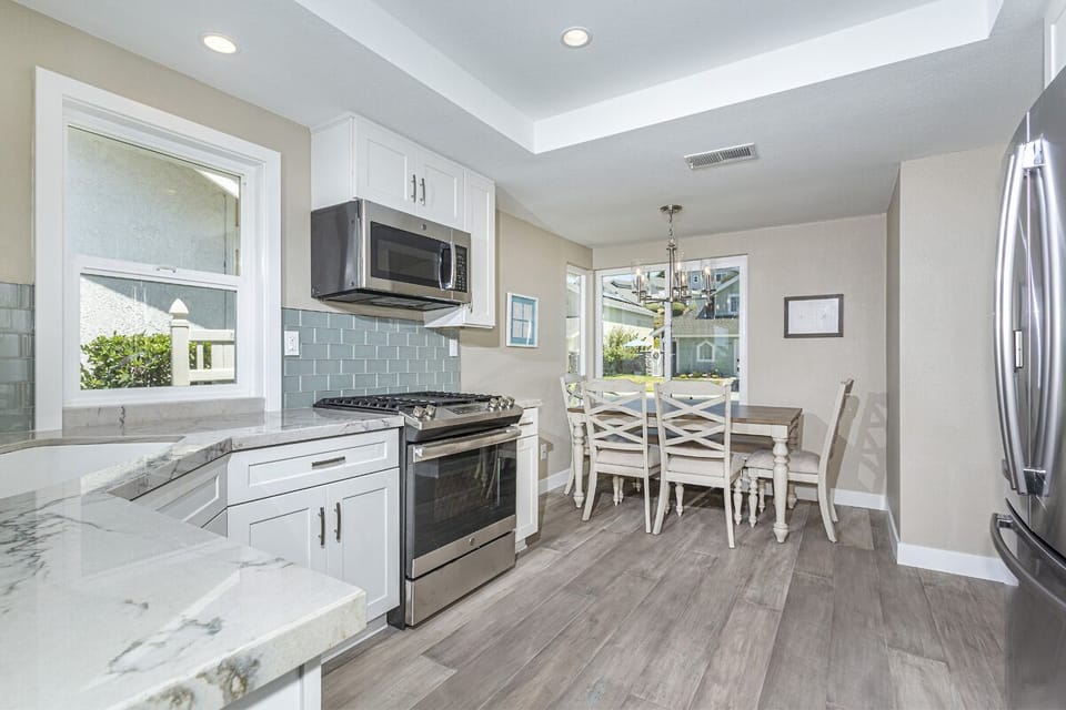 Kitchen view from entrance, new GE stainless steel appliances, breakfast nook!