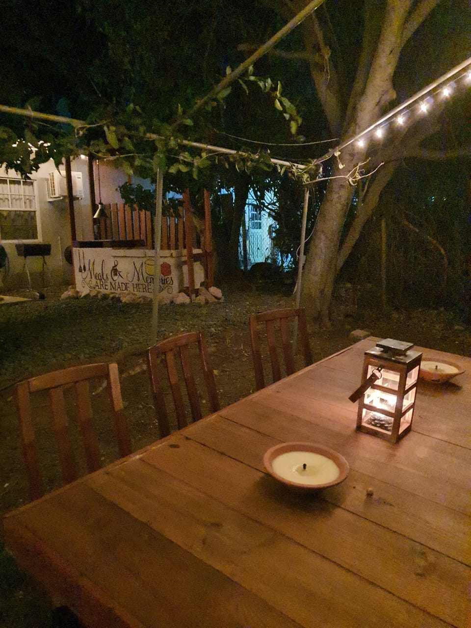 Magical outdoor dining area with string lights, perfect for evening meals