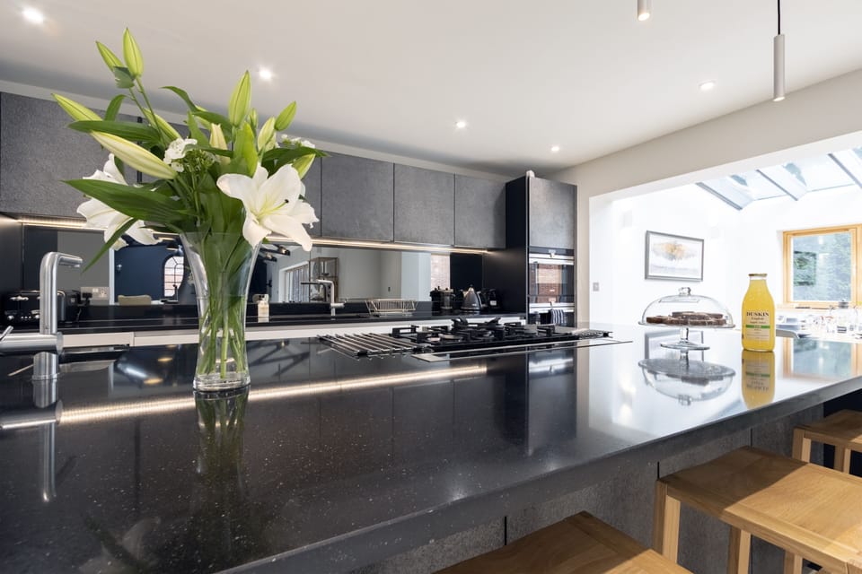 Modern kitchen with granite worktops and island
