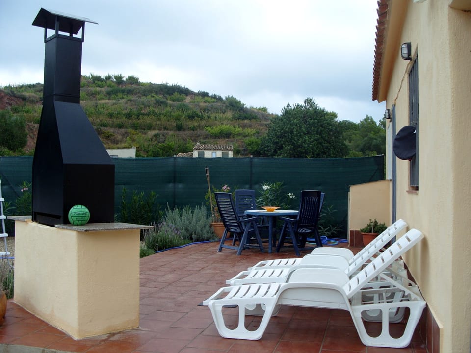 Large patio in the enclosed garden with around stunning mountain views