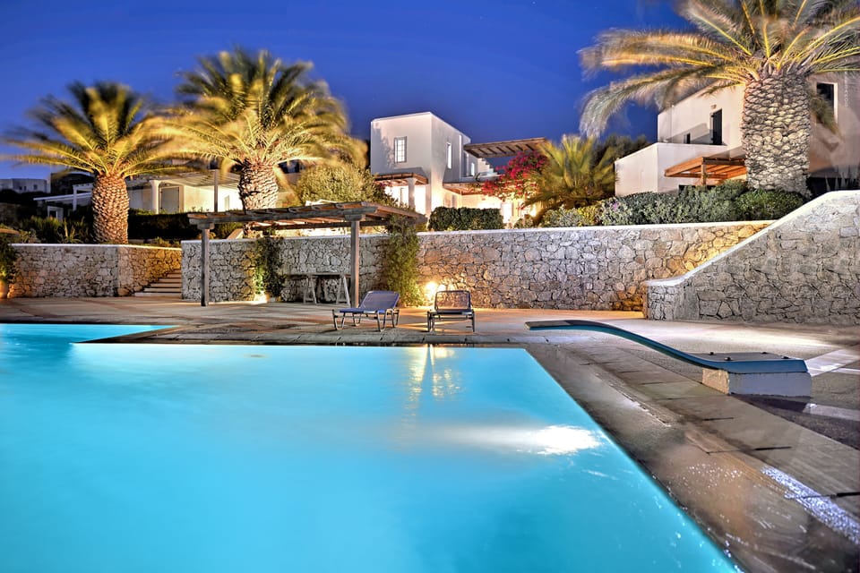 The villa and pool at sunset