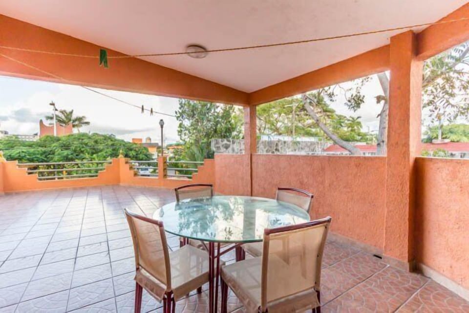 A large 2nd floor terrace has a small table
