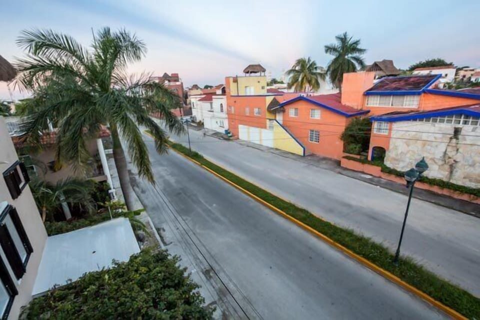 Rooftop view of quiet residential street in front of house