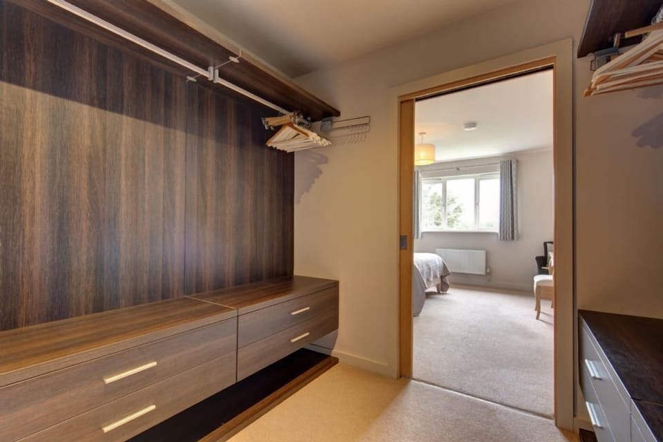 First floor: Master bedroom with large walk in dressing room